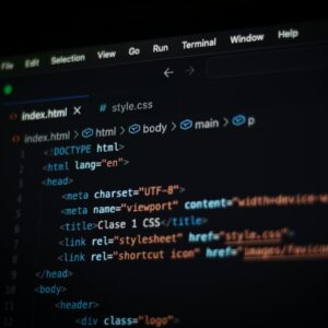 Menu Close-up of HTML code displayed on a computer screen in dark mode, focusing on programming concepts.