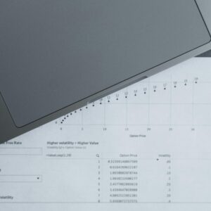 A top-down view of analytical data sheets and a laptop, ideal for business analysis themes.