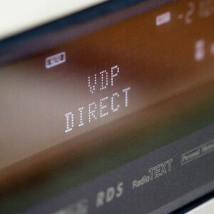 Extreme close-up of an electronic screen showing 'VDP DIRECT' in bold letters.